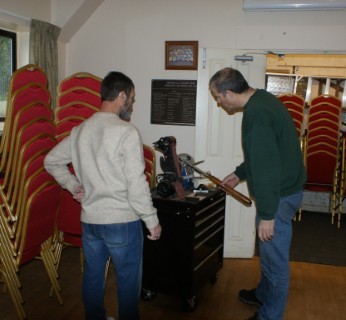 Geoff showing great interest in Paul doing a fingernail grind